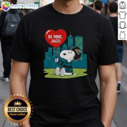 Alt Text: Happy Jacksonville Jaguars X Snoopy Cartoon Valentine 2026 T-Shirt featuring playful graphics and team colors.