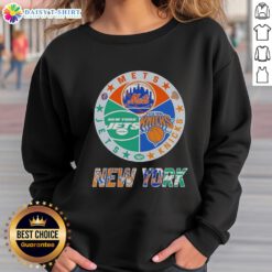 Alt Text: Happy New York City sports sweatshirt featuring Mets, Knicks, and Jets logos in a stylish design.