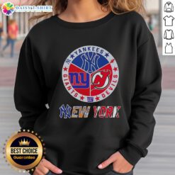 Happy New York City sports sweatshirt featuring Yankees, Devils, and Giants logos for passionate fans.