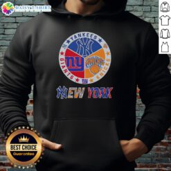 Alt Text: Happy New York City sports hoodie featuring Yankees, Knicks, and Giants logos for passionate fans.