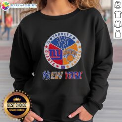 Happy New York City sports sweatshirt featuring Yankees, Knicks, and Giants logos for fans of NYC teams.