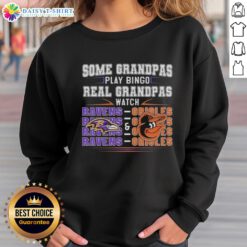 Funny sweatshirt featuring Baltimore Ravens and Orioles theme: 'Real Grandmas Watch' perfect for sports-loving grandmas.