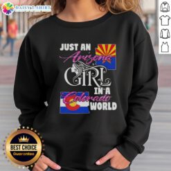 Arizona girl wearing a cozy sweatshirt in Colorado, showcasing the 'Just An Arizona Girl In A Colorado World' design.