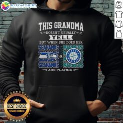 Grandma wearing a Seattle Seahawks and Mariners hoodie, ready to cheer passionately for her teams.