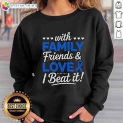 Group of friends wearing 'Beat It' colon cancer sweatshirts with blue ribbons, celebrating survival and support together.