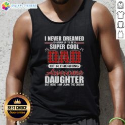 Girl wearing a 'Super Cool Daughter' tank top, showcasing fun and stylish design perfect for proud parents.
