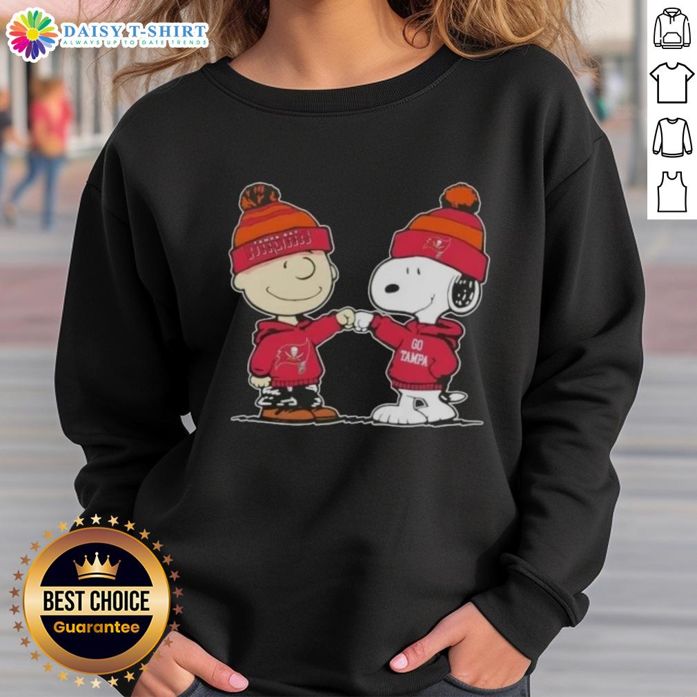 Alt Text: Top Peanuts Charlie Brown fist bump with Snoopy on Tampa Bay Buccaneers football sweatshirt design.