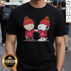 Top Peanuts Charlie Brown and Snoopy fist bump on Tampa Bay Buccaneers football T-shirt design.