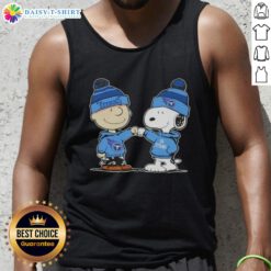 Alt Text: Charlie Brown and Snoopy fist bump on a Tennessee Titans football tank top featuring Peanuts characters.
