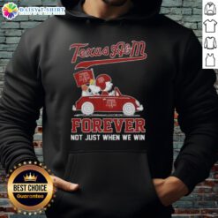 Charlie Brown and Snoopy driving a car on a Texas A&M Aggies hoodie, celebrating fandom beyond just winning.