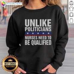 Funny sweatshirt featuring sarcastic text about nurses needing qualifications unlike politicians - perfect for healthcare humor.