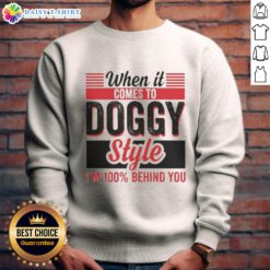 Retro sweatshirt featuring the phrase '100% Behind You' with a playful dog graphic, perfect for dog lovers.
