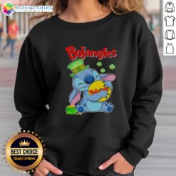 Alt Text: Cute Stitch hugging the Bojangles logo on a Happy St. Patrick's Day sweatshirt, perfect for festive celebrations.