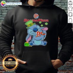 Alt Text: Cute Stitch hugs the Boston Pizza logo on a Happy St. Patrick's Day hoodie, perfect for festive celebrations.