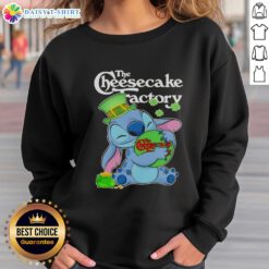 Alt Text: Cute Stitch hugging The Cheesecake Factory logo on a Happy St. Patrick's Day sweatshirt design.