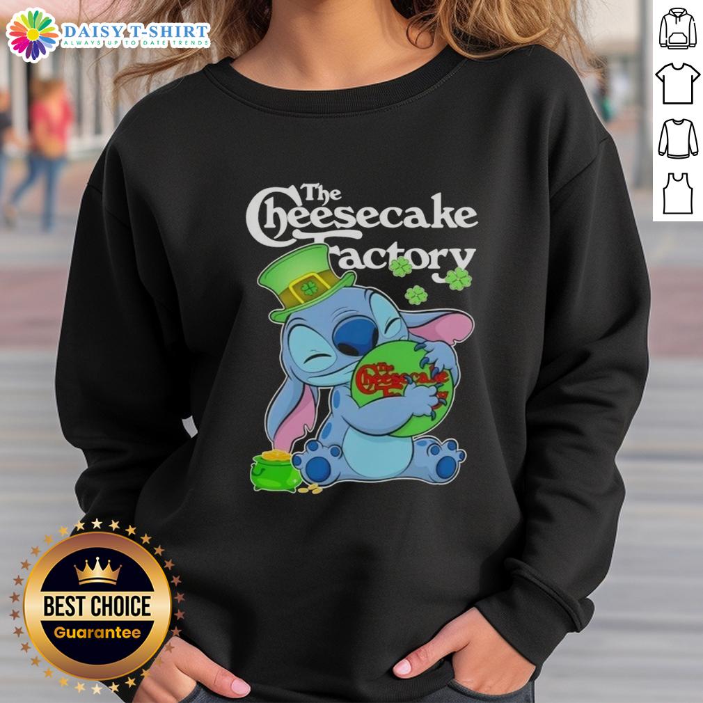 Alt Text: Cute Stitch hugging The Cheesecake Factory logo on a Happy St. Patrick's Day sweatshirt design.