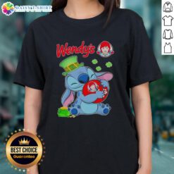 Alt Text: Cute Stitch hugging a St. Patrick's themed Wendy's logo on a stylish ladies tee perfect for festive celebrations.