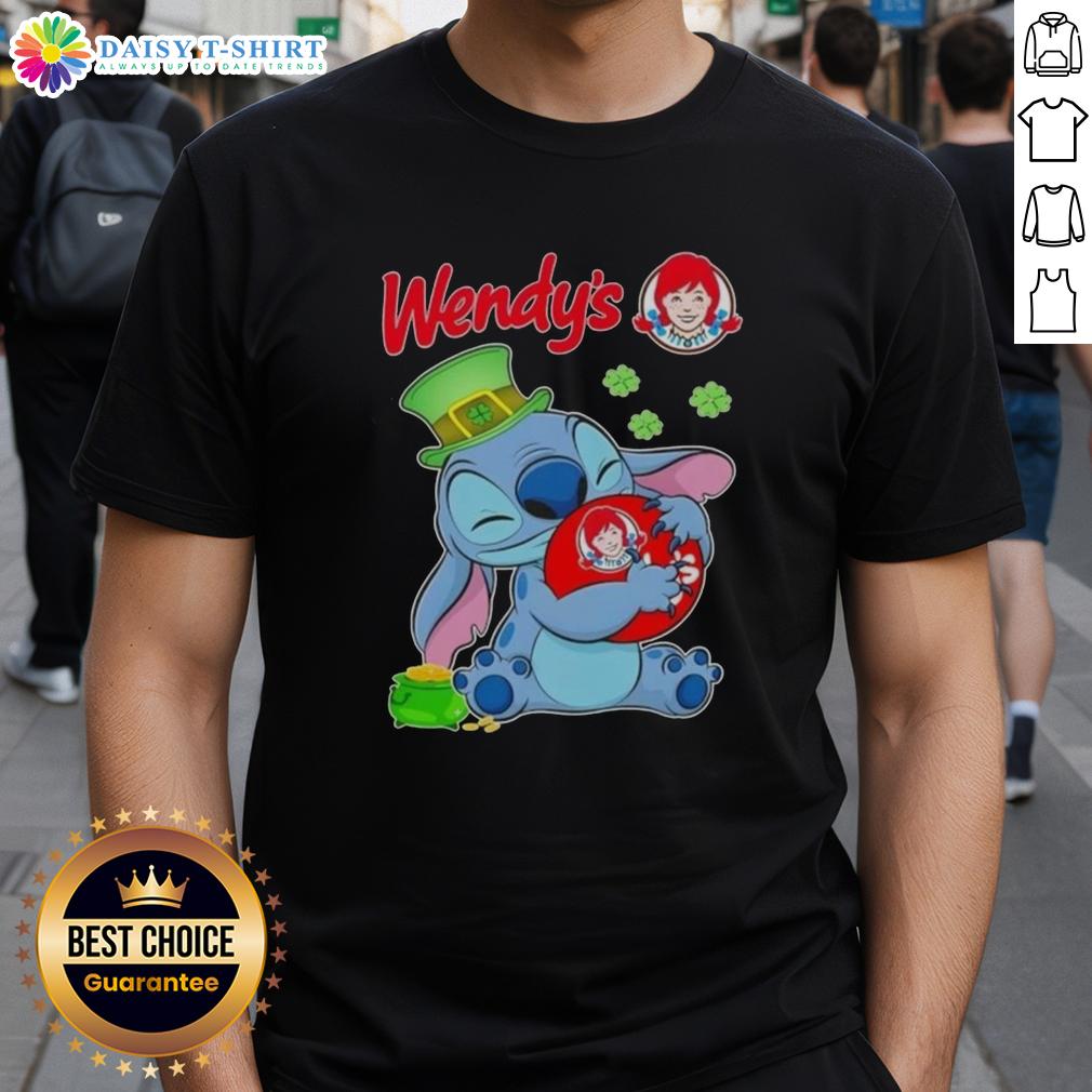 Alt Text: Cute Stitch character hugging Wendy's logo on a St. Patrick's Day themed t-shirt design, perfect for festive celebrations.