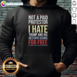 Person wearing 'Good Not a Paid Protestor - I Hate Trump' hoodie at a protest, showcasing anti-Trump sentiment and activism.