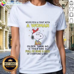 Funny Snoopy tee with quote: 'Never pick a fight with a woman over 60' perfect for ladies who love humor and peanuts.