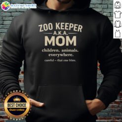 Mom in a hoodie surrounded by children and animals at the zoo, showcasing the joy of being a good zoo keeper.