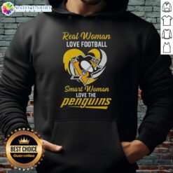 Smart woman in a heart hoodie, showing her love for the Pittsburgh Penguins and football.