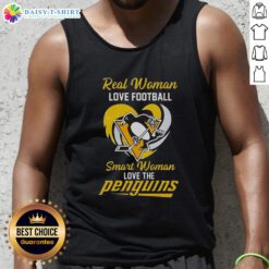 Smart woman in a heart tank top showing love for the Pittsburgh Penguins while enjoying football outdoors.
