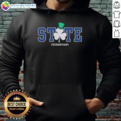 Person wearing a Nice State Shenanigans Irish Green Hoodie, showcasing vibrant color and fun design outdoors.