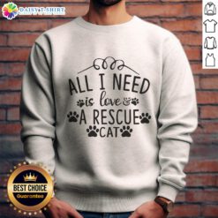 Alt Text: Official 'All I Need Is Love' Rescue Cat Sweatshirt featuring a cute cat graphic, perfect for cat lovers.