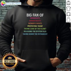 Protester wearing 'Awesome Big Fan of Immigrants Human Rights' hoodie, advocating for women's rights and environmental care.