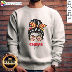 Awesome Kansas City Chiefs girl in messy bun and glasses wearing a stylish sweatshirt, showcasing team spirit and fashion.