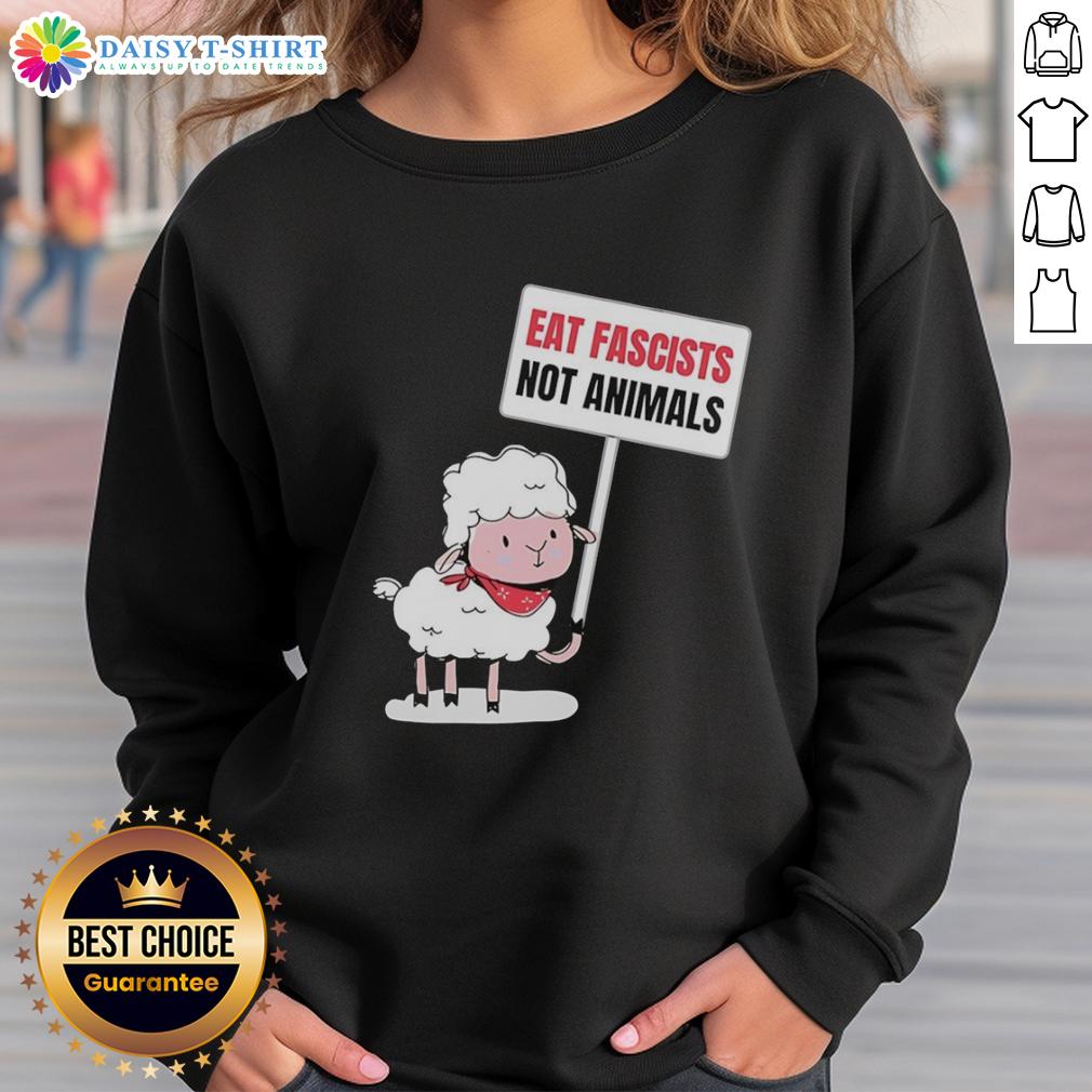 Good sheep holding a sign saying 'Eat Fascists Not Animals' on a funny sweatshirt, promoting a humorous message.