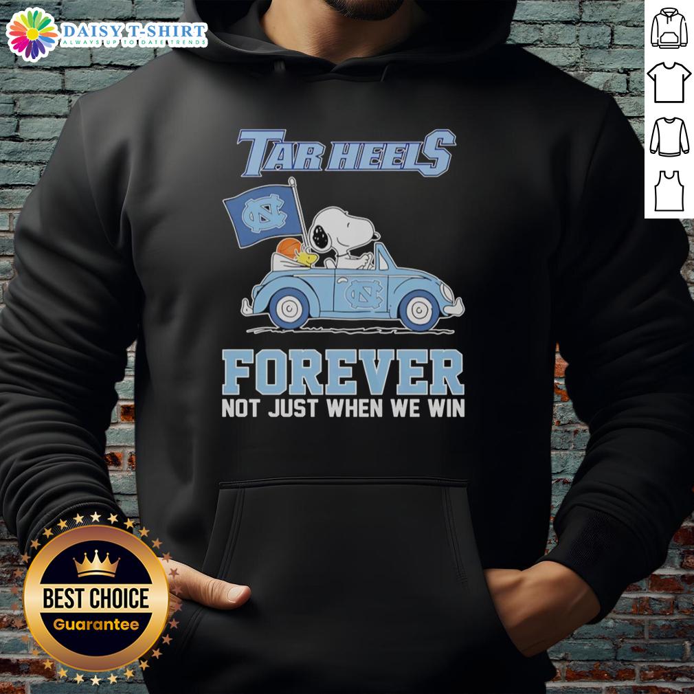 Good Snoopy and Woodstock diving in North Carolina Tar Heels hoodie, celebrating team spirit beyond just wins.