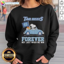 Good Snoopy and Woodstock diving on a North Carolina Tar Heels sweatshirt, perfect for fans, not just when we win.
