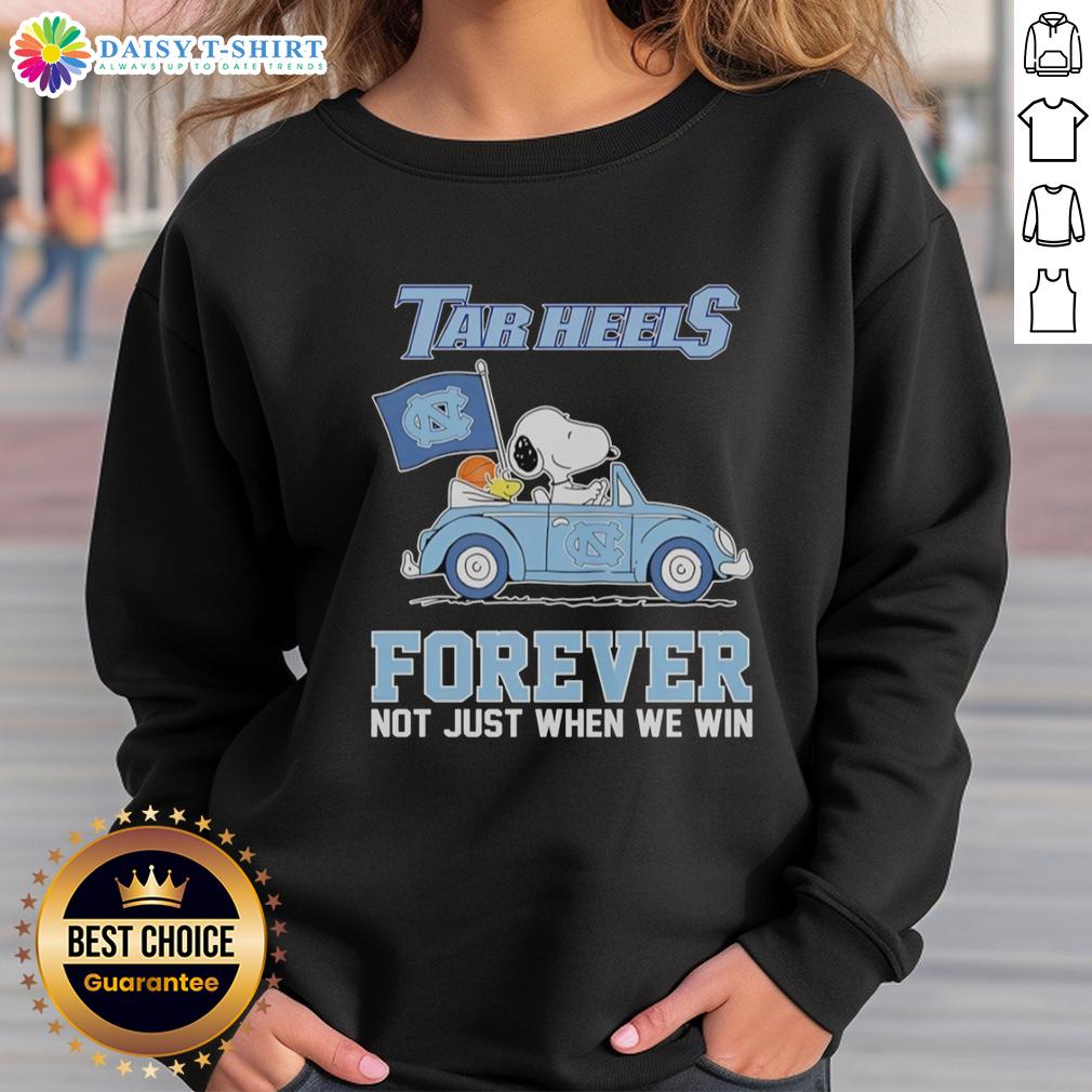 Good Snoopy and Woodstock diving on a North Carolina Tar Heels sweatshirt, perfect for fans, not just when we win.