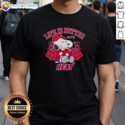 Alt Text: Snoopy holding Miami Heat logo on a stylish 'Life Is Better With Heat' T-shirt, perfect for Heat fans.