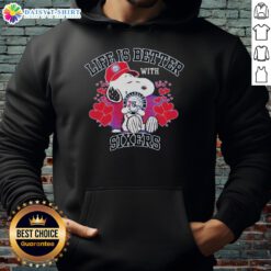 Snoopy wearing a Philadelphia 76ers hoodie with 'Life Is Better With Sixers' slogan, showcasing team spirit.