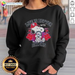 Snoopy wearing a Philadelphia 76ers sweatshirt, showcasing 'Life Is Better With Sixers' design.