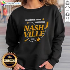 Alt Text: Official Nashville Predators The Road to the Cottage sweatshirt, showcasing team colors and logo in a cozy design.