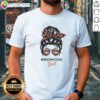 Alt Text: Top Denver Broncos Girl Messy Bun Glasses T-Shirt featuring a stylish design perfect for fans and casual wear.