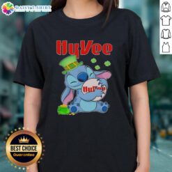 Top Stitch Hug St. Patrick's Day ladies tee featuring Hy-Vee logo in festive green design for a stylish celebration.