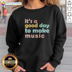 Dynamic 'Hot It's A Good Day To Make Music' sweatshirt in vibrant colors, perfect for music lovers and casual wear.
