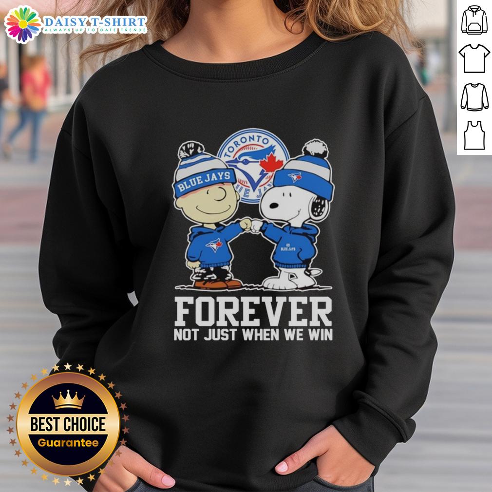 Charlie Brown fist pump in Toronto Blue Jays sweatshirt, celebrating team spirit with Snoopy. Forever, not just when we win!