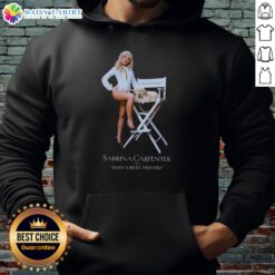Pretty Sabrina Carpenter wearing a stylish 'Man's Best Friend' hoodie, showcasing her trendy fashion sense and love for pets.