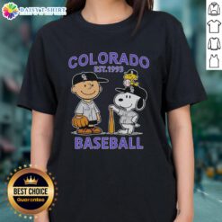 Top Charlie Brown, Snoopy, and Woodstock in Colorado Rockies jersey, Est. 1993, on a stylish ladies tee.