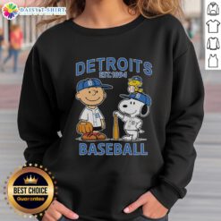 Alt Text: Charlie Brown, Snoopy, and Woodstock wearing a Detroit Tigers baseball jersey sweatshirt established in 1894.