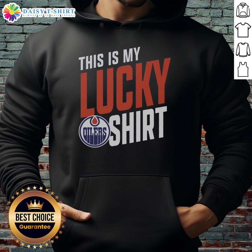 Edmonton Oilers fan wearing a This Is My Lucky Hoodie cheering at a game, showcasing team spirit and passion.