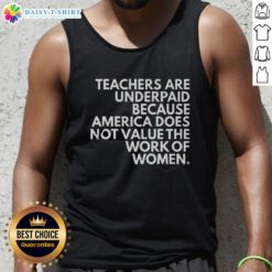 Female teacher wearing a tank top that reads 'Top Teachers Are Underpaid' highlighting the undervaluation of women's work.