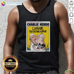 Two men kissing while wearing a 'Charlie Hebdo L'Amour Plus Fort Que La Haine' tank top, symbolizing love over hate.