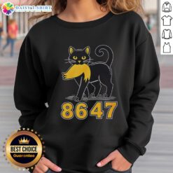 Good Black Cat wearing an Anti-Trump sweatshirt, showcasing a playful and bold political statement.